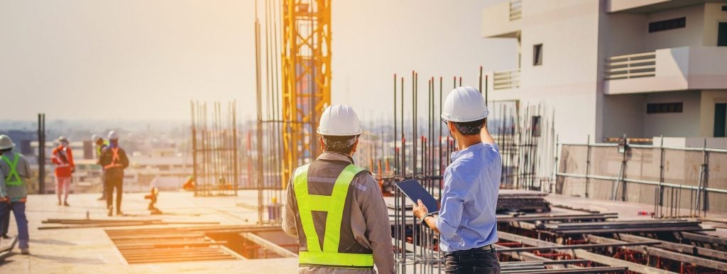 construction workers on top of a building